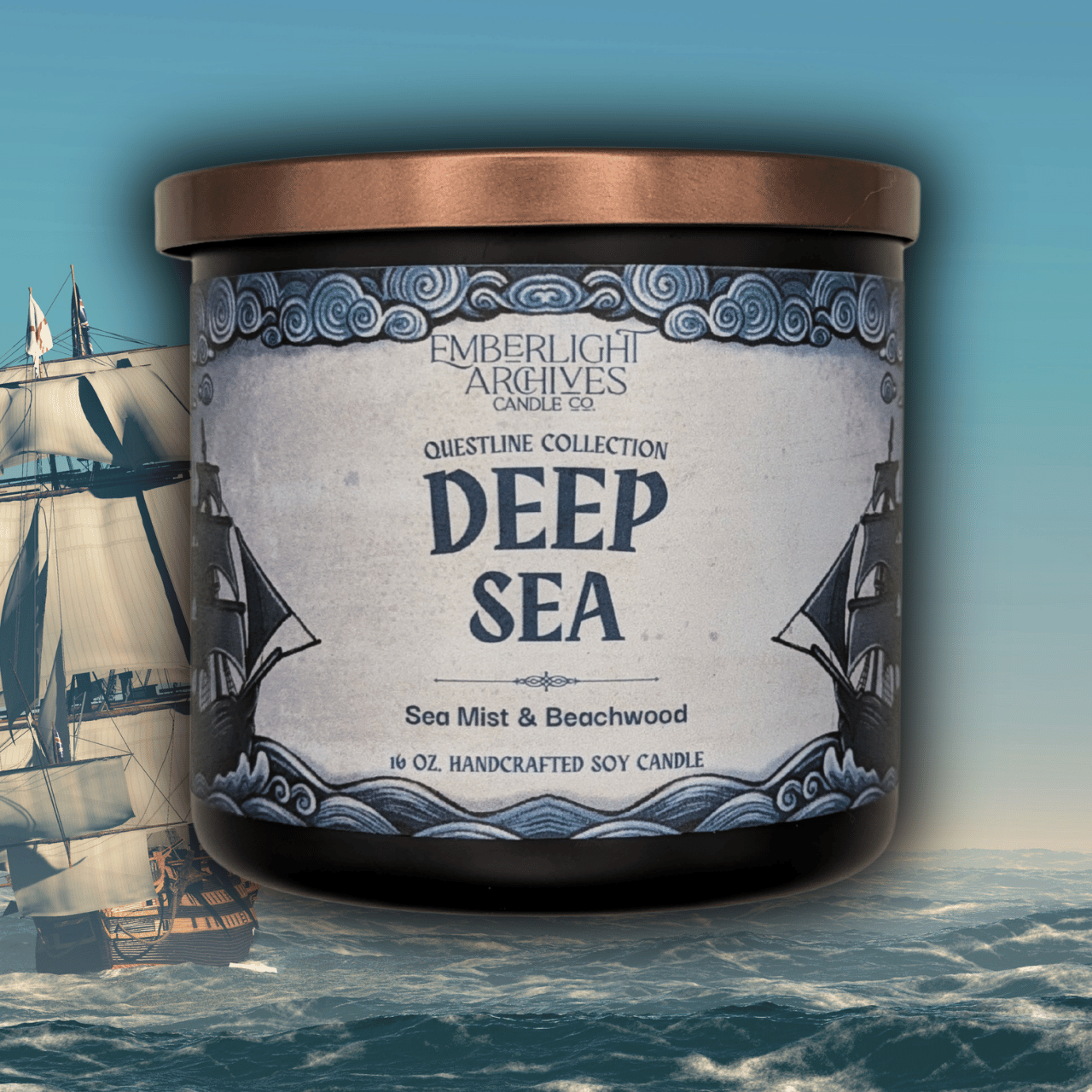 16oz Deep Sea candle by Emberlight Archives in a black glass jar with illustrated sailing ship label against an ocean background, Sea Mist and Beachwood scent.