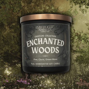 9oz Enchanted Woods candle by Emberlight Archives in a black glass jar with illustrated forest label against a forest background, Pine and Clove scent.