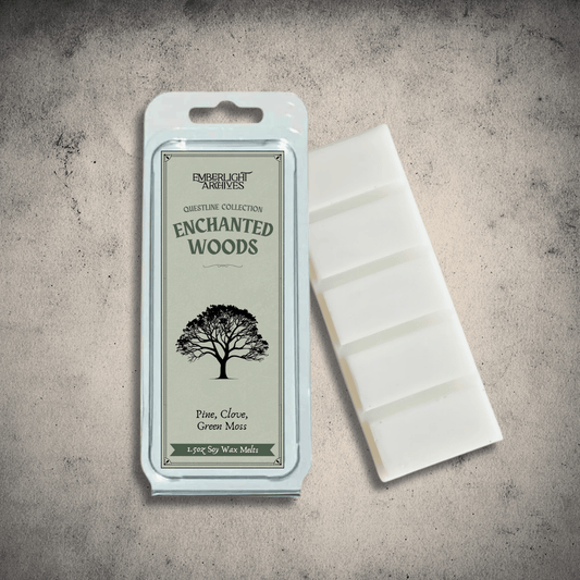 Emberlight Archives Enchanted Woods wax melt bar with a green label against a gray stone background, Pine and Clove scent.