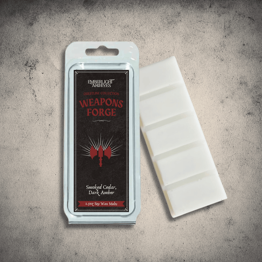 Emberlight Archives Weapon's Forge wax melt bar with a black label against a gray stone background, Amber and Cedar scent.