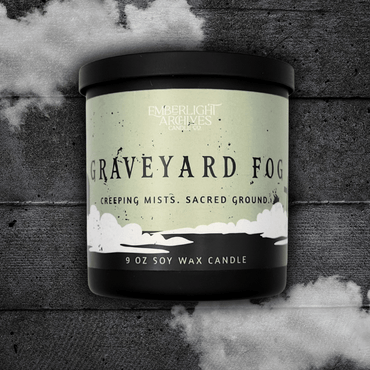 9oz candle in a black jar labeled 'Graveyard Fog' by Emberlight Archives on a textured dark background with smoke effect.