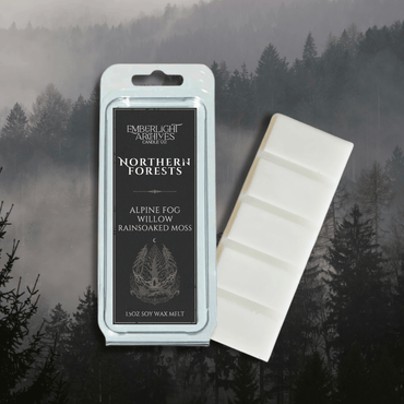 Northern Forests wax melt bar by Emberlight Archives with a black label against a forest background, Rain & Moss scent.