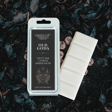 Old Gods wax melt bar by Emberlight Archives with a black label against a grassy background, Fruit Jam & Musk scent.