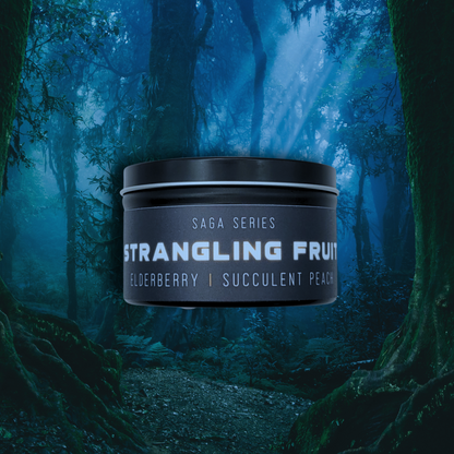 8oz Strangling Fruit candle by Emberlight Archives in a black tin with black label against a forest background, Elderberry & Peach scent.