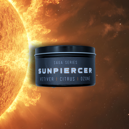 8oz Sunpiercer candle by Emberlight Archives in a black tin with black label against an fiery background, Citrus scent.