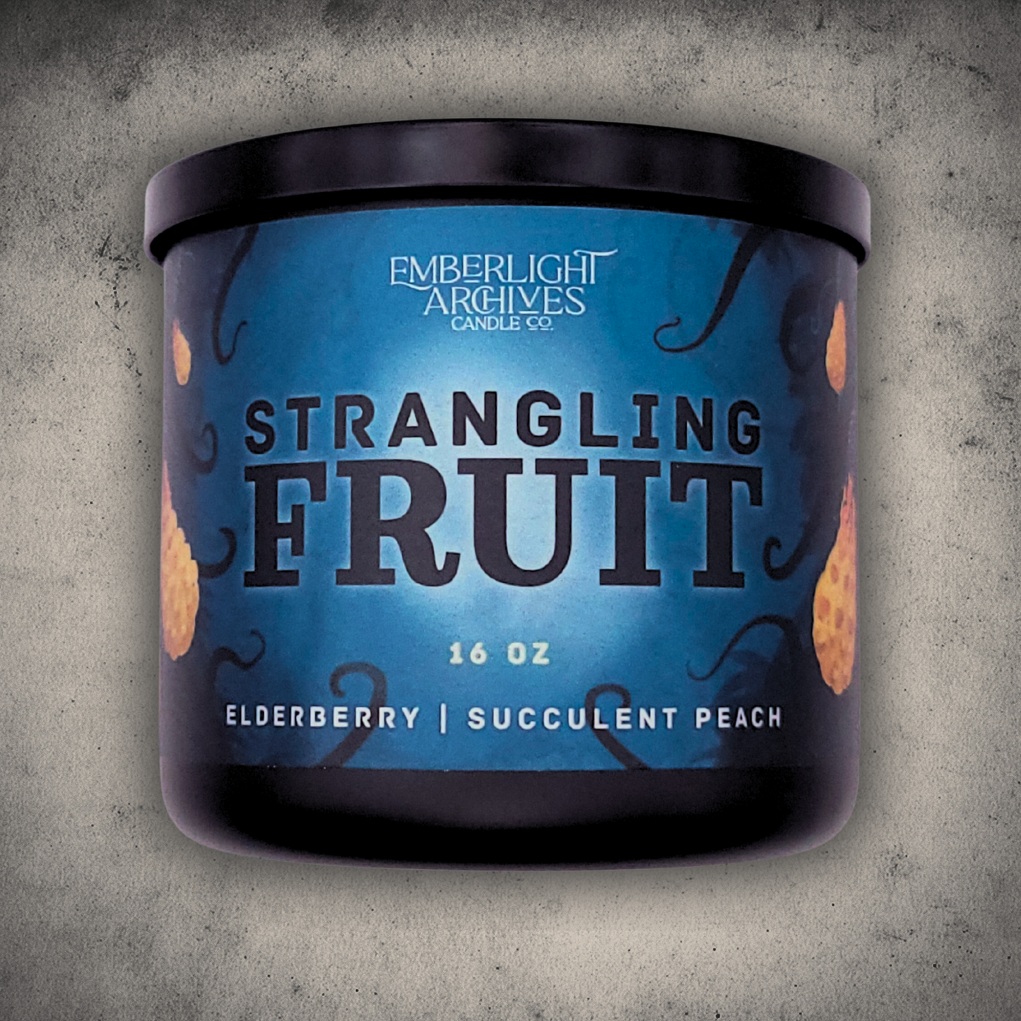 Emberlight Archives Strangling Fruit candle in a 16oz black glass jar with illustrated alien planet label against a gray stone background, Elderberry & Peach scent.