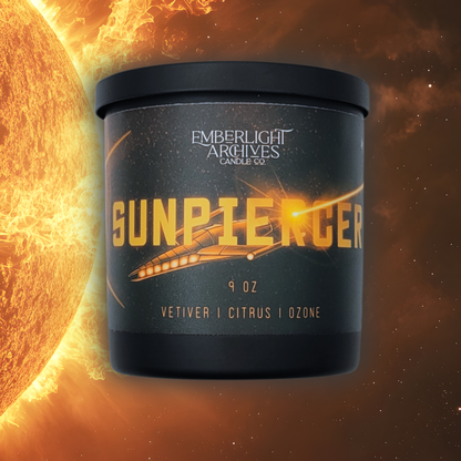 9oz Sunpiercer candle by Emberlight Archives in a black glass jar with illustrated spaceship label against an fiery background, Citrus scent.