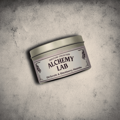 Emberlight Archives Alchemy Lab candle in an 8oz silver tin against a gray stone background, Old Scrolls and Blackberry Absinthe scent.