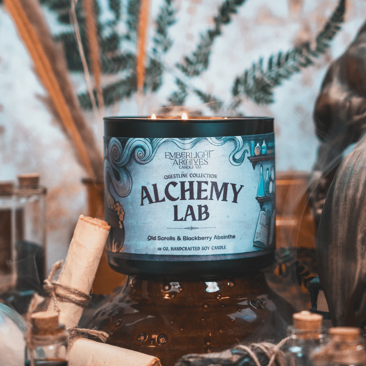 Candle labeled 'Alchemy Lab' with decorative elements in the background