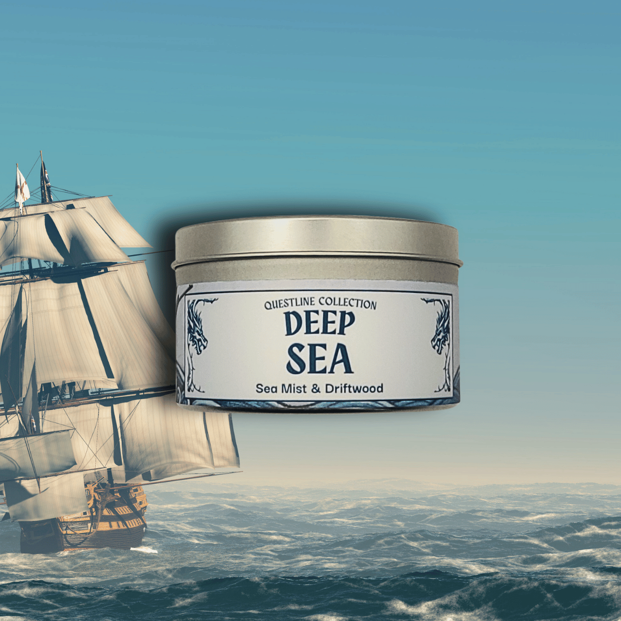 Deep Sea candle by Emberlight Archives in a silver tin with illustrated sailing ship label against an ocean background, Sea Mist and driftwood scent.