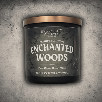 Emberlight Archives Enchanted Woods candle in a 9oz black glass jar with illustrated forest label against a gray stone background, Pine and Clove scent.