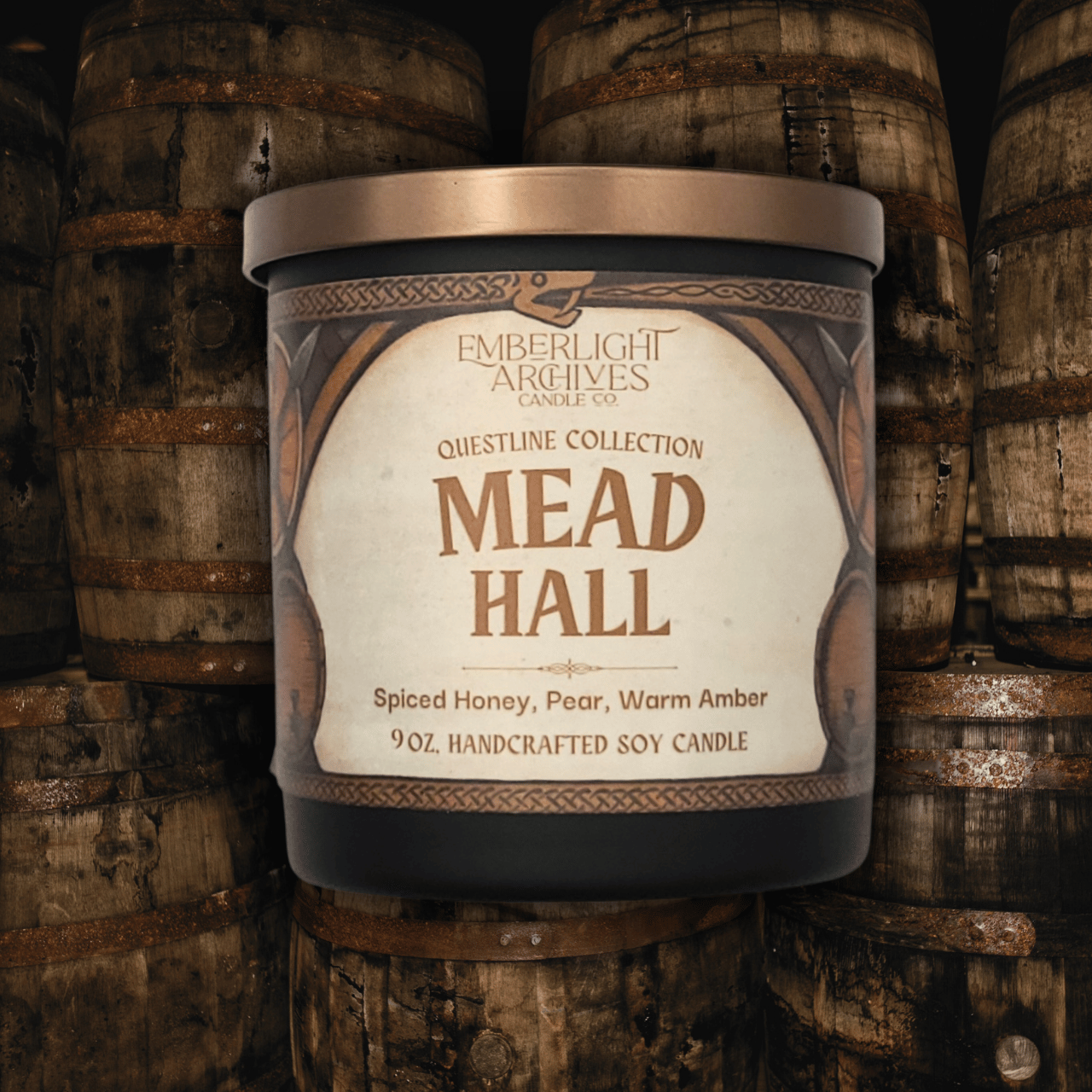 Emberlight Archives Mead Hall candle in a black glass jar with illustrated label against a mead barrels background, Pear and Spiced Honey scent.