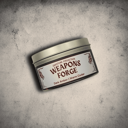 Emberlight Archives Weapon's Forge candle in an 8oz tin with illustrated blacksmith label against a gray stone background, Amber and Cedar scent.