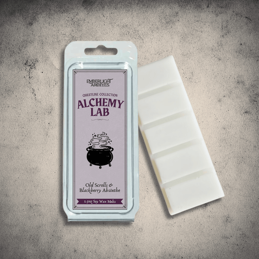 Emberlight Archives Alchemy Lab wax melt bar with a purple label against a gray stone background, Old Scrolls and Blackberry Absinthe scent.