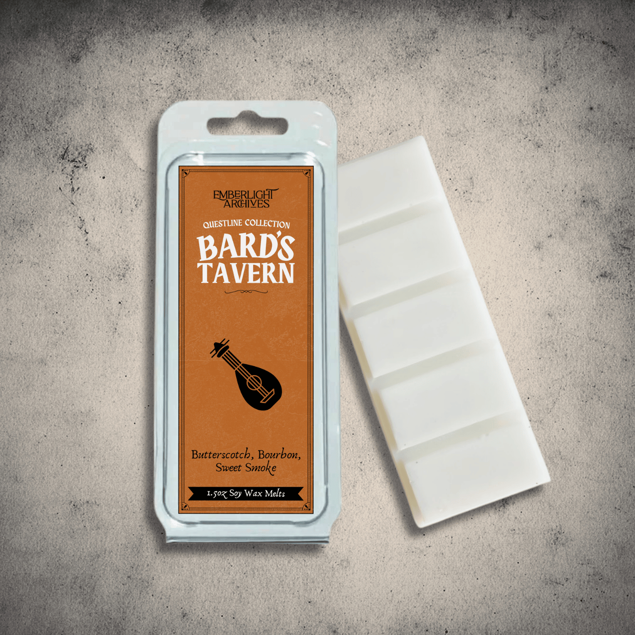 Emberlight Archives Bard's Tavern wax melt bar with a orange label against a gray stone background, Butterscotch and Bourbon scent.