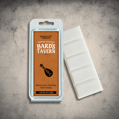 Emberlight Archives Bard's Tavern wax melt bar with a orange label against a gray stone background, Butterscotch and Bourbon scent.