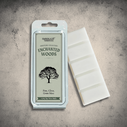 Emberlight Archives Enchanted Woods wax melt bar with a green label against a gray stone background, Pine and Clove scent.