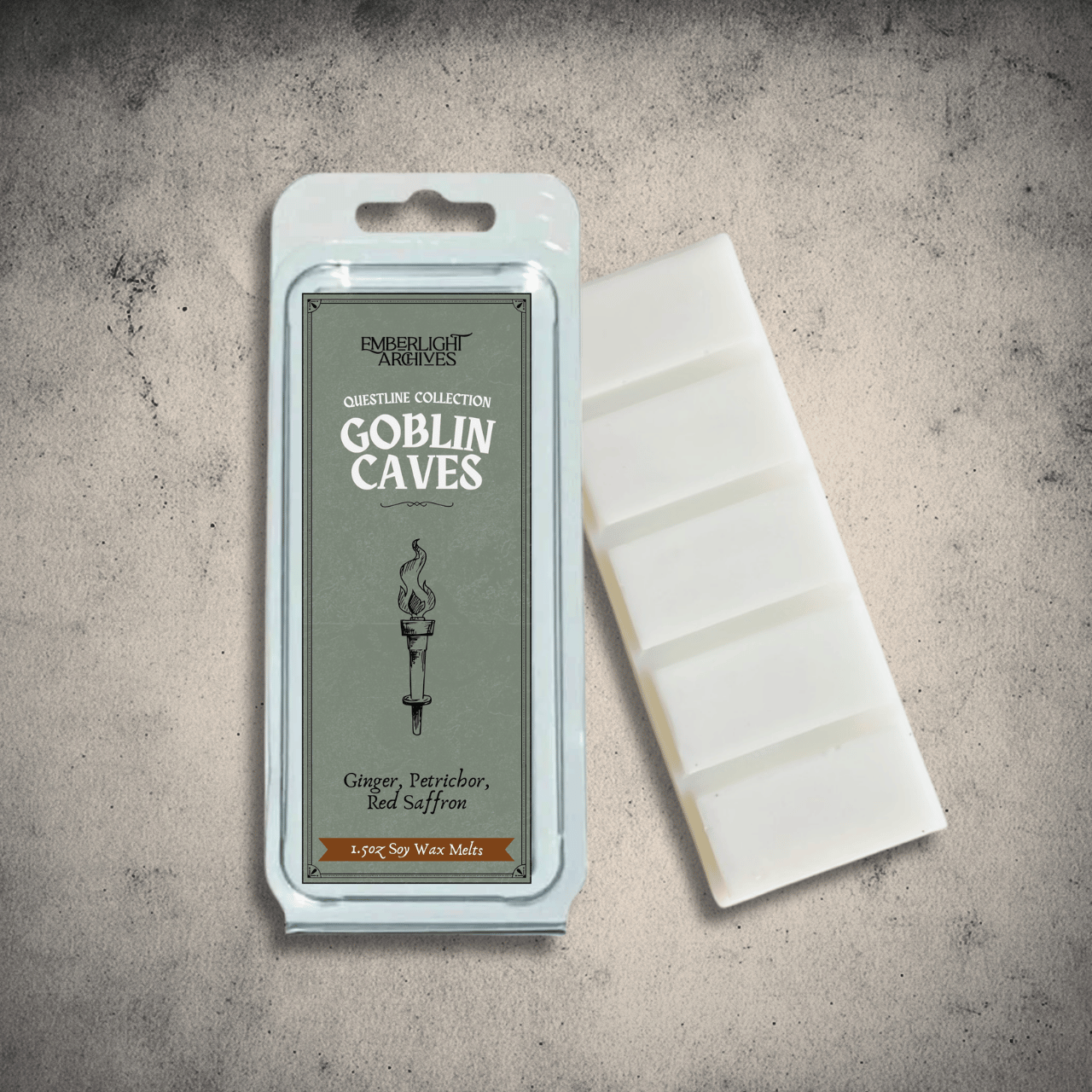 Emberlight Archives Goblin Caves wax melt bar with a green label against a gray stone background, Petrichor and Ginger scent.