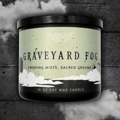 16oz Graveyard Fog candle by Emberlight Archives in a black jar with pale green label against a dark wood background.