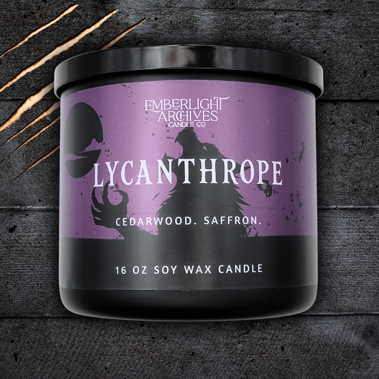 Lycanthrope horror candle by Emberlight Archives – 16oz black glass jar with purple werewolf label against a dark background, Cedarwood & Saffron scent.