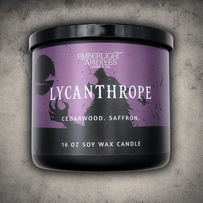 Emberlight Archives Lycanthrope horror candle – 16oz black glass jar with purple werewolf label against a gray stone background, Cedarwood & Saffron scent.