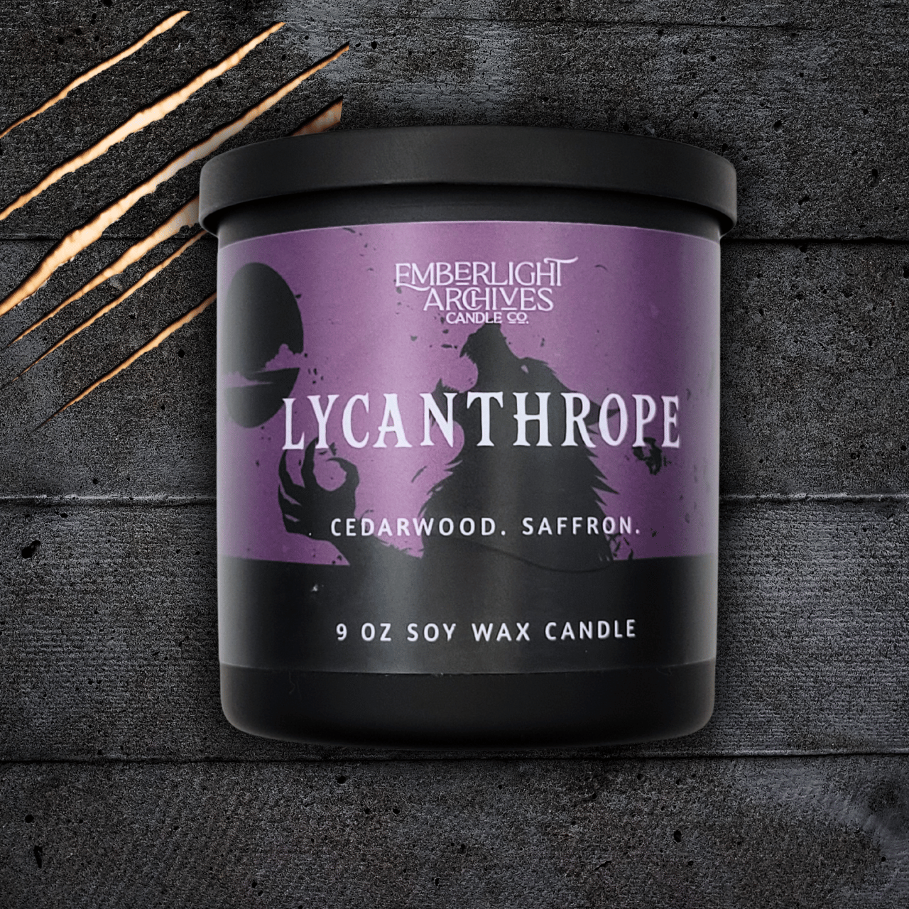 Lycanthrope horror candle by Emberlight Archives – 9oz black glass jar with purple werewolf label against a dark background, Cedarwood & Saffron scent.