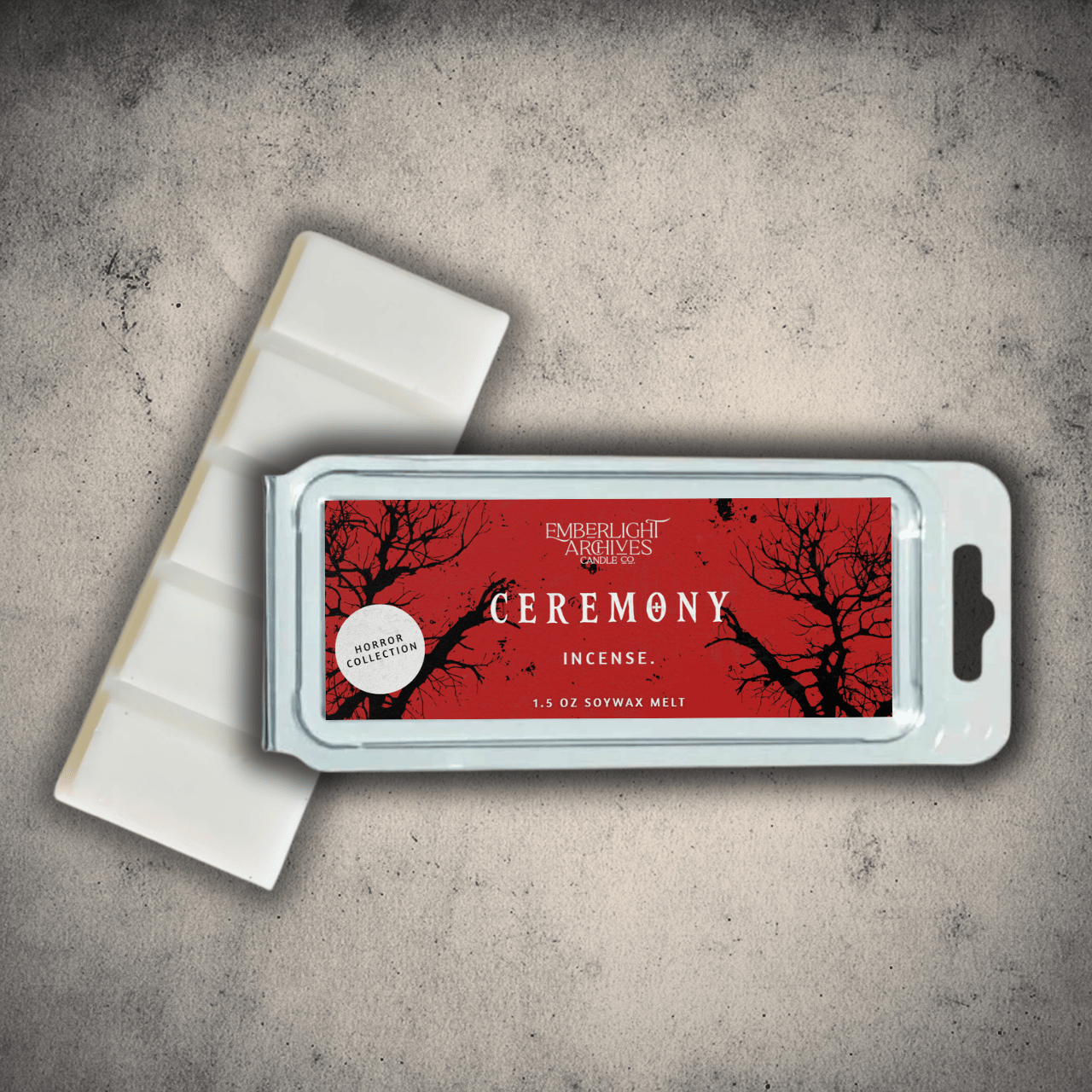 Emberlight Archives Ceremony wax melt bar with a red label against a gray stone background, Incense scent.