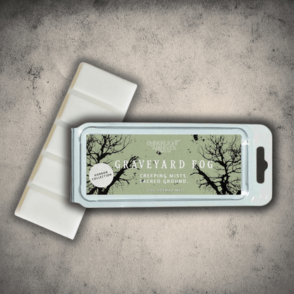 Emberlight Archives Graveyard Fog wax melt bar with a pale green label against a gray stone background.