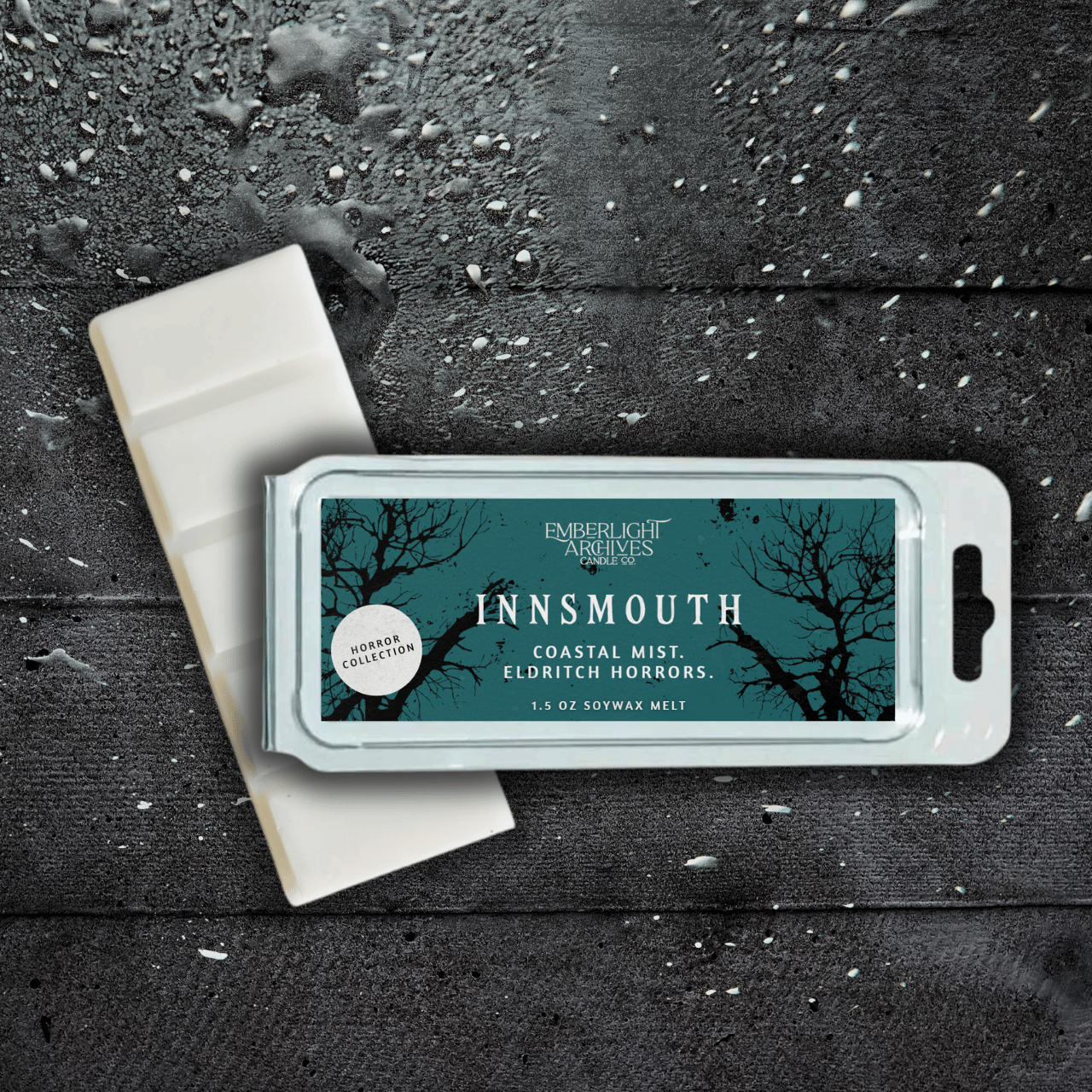 Innsmouth wax melt bar by Emberlight Archives with a blue label against a dark wood background, Coastal Winds and Black Coral scent.