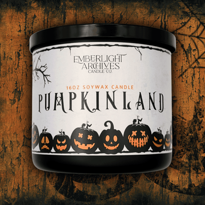 Candle with 'Pumpkinland' label on a textured orange wooden background.