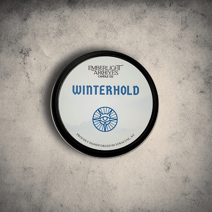 White Winterhold tin lid on gray stone background.