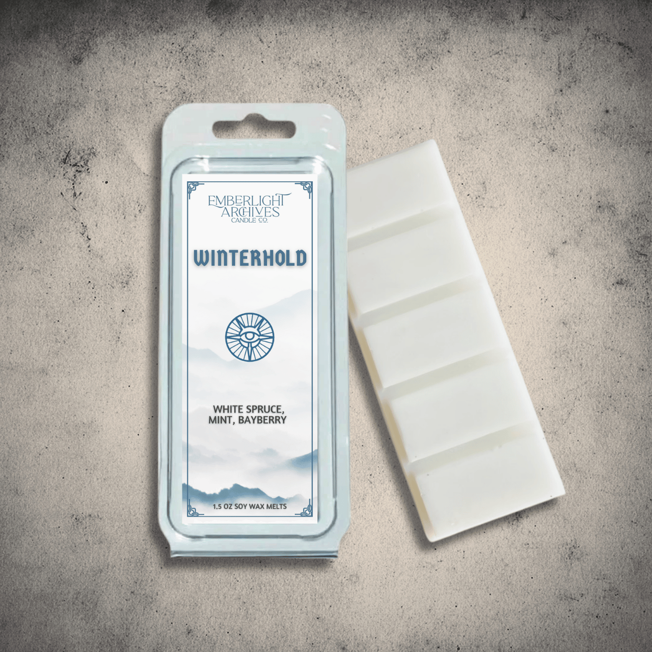 Emberlight Archives Winterhold wax melt bar with a white label against a gray stone background, spruce & mint  scent.