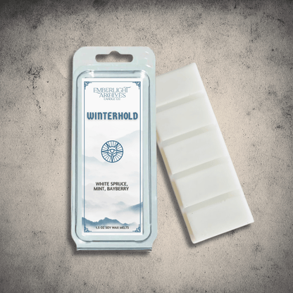 Emberlight Archives Winterhold wax melt bar with a white label against a gray stone background, spruce & mint  scent.