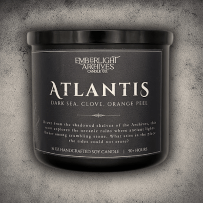 Emberlight Archives Atlantis candle in a 16oz black glass jar with dark label against a gray stone background, Dark Sea and Orange Peel scent.