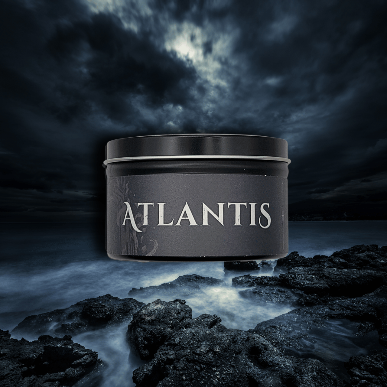 9oz Atlantis candle by Emberlight Archives in a black glass jar with dark label against a dark sea background, Dark Sea and Orange Peel scent.