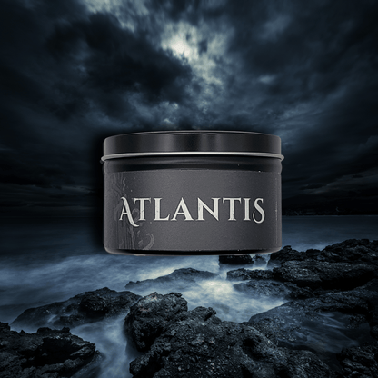 9oz Atlantis candle by Emberlight Archives in a black glass jar with dark label against a dark sea background, Dark Sea and Orange Peel scent.