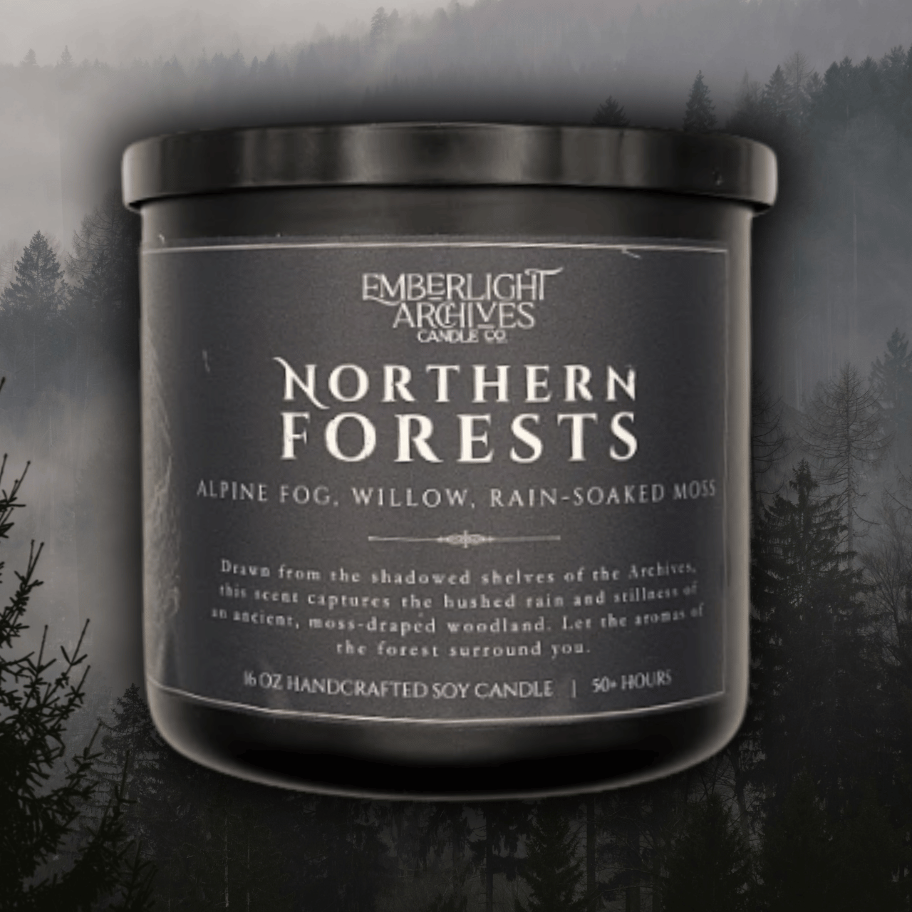 16oz Northern Forests candle by Emberlight Archives in a black glass jar with dark label against a forest background, Rain & Moss scent.