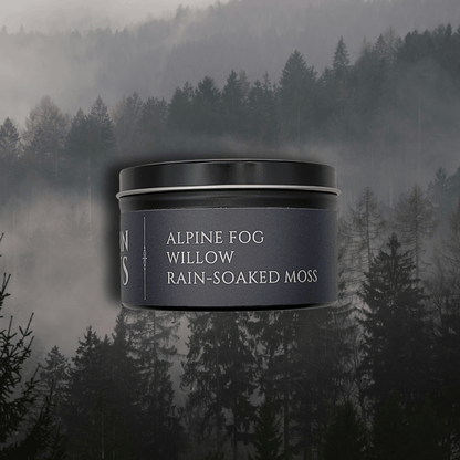 Jar labeled 'Alpine Fog Willow Rain-Soaked Moss' against a misty forest background