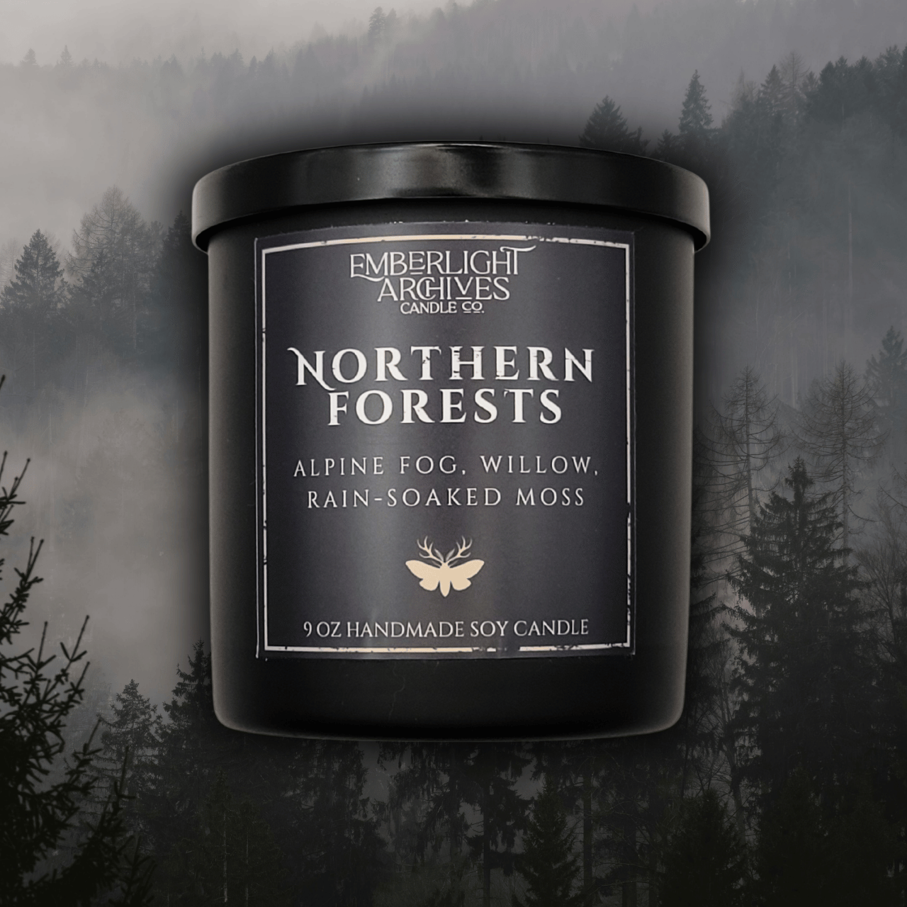 9oz Northern Forests candle by Emberlight Archives in a black glass jar with dark label against a forest background, Rain & Moss scent.