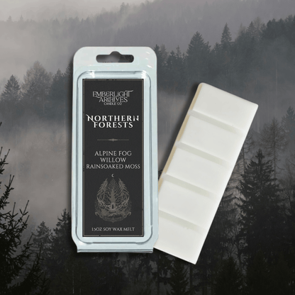 Northern Forests wax melt bar by Emberlight Archives with a black label against a forest background, Rain & Moss scent.