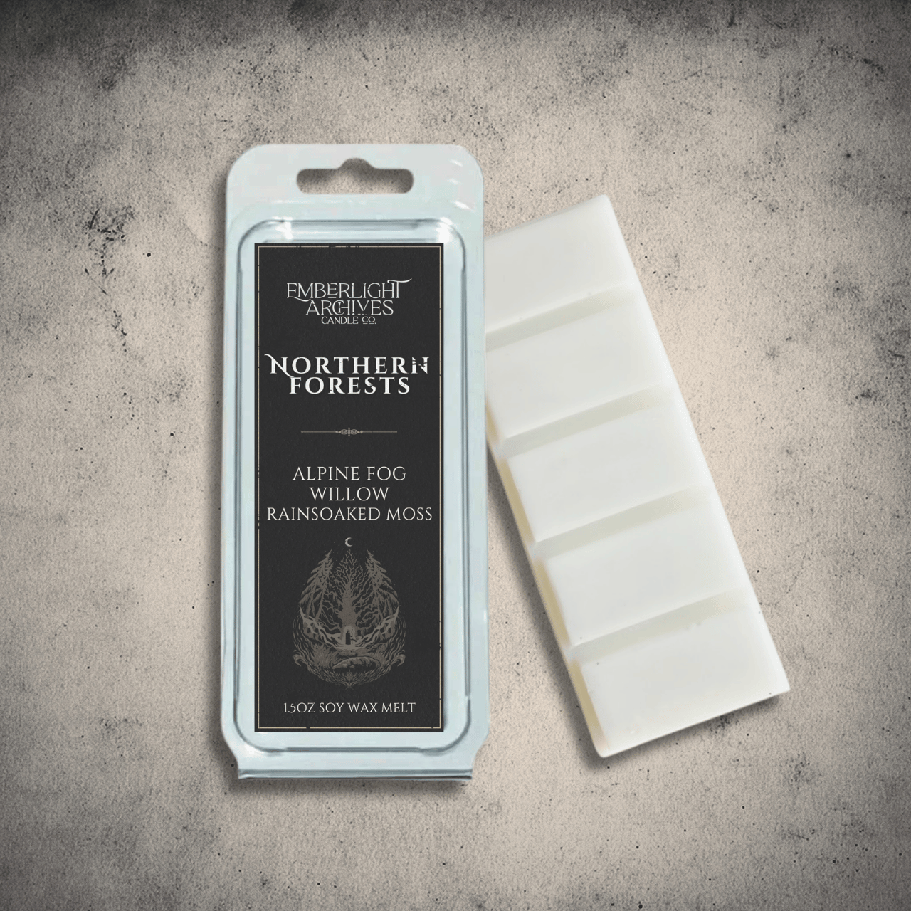 Emberlight Archives Northern Forests wax melt bar with a black label against a gray stone background, Rain & Moss scent.