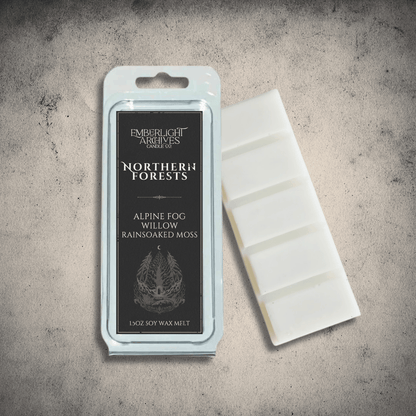Emberlight Archives Northern Forests wax melt bar with a black label against a gray stone background, Rain & Moss scent.